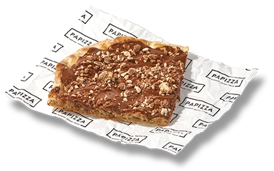 Deliciosa pinsa dulces, con base de crema de cacao y avellanas y tu topping favorito